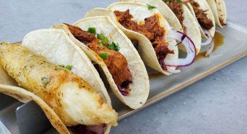 plate-of-fish-pork-beef-tacos
